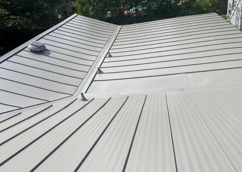 Solar attic fan installed on a metal roof for Roof Ventilation in Big Bear Lake